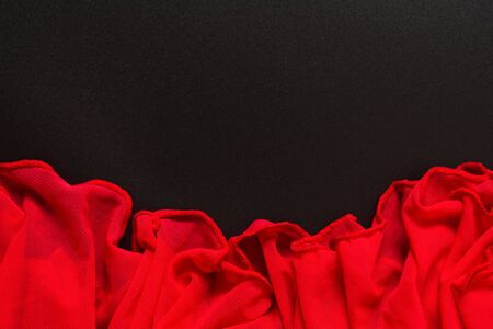 Red and black textile romantic fabric design background. Passion in backdrop. Flat lay. Top viewの写真素材