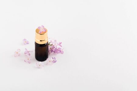 Glass bottle with chemistry liquid. Mock-up. Essential oil or perfume. Spa concept. Closeup view Copy spaceの写真素材