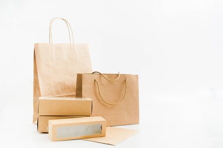 Recyclable paper bags and boxes on white background. Shopping conceptの写真素材