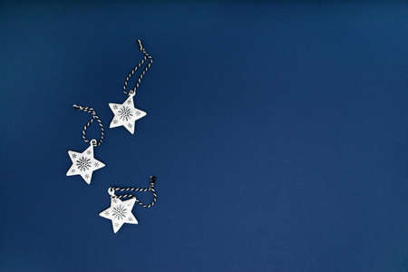 White stars christmas decorations on blue backgroundの写真素材