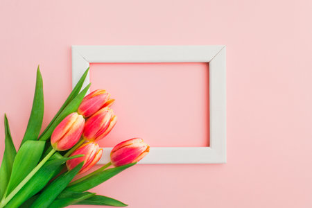 Beautiful pink and yellow tulips in bouquet over white backgroundの写真素材