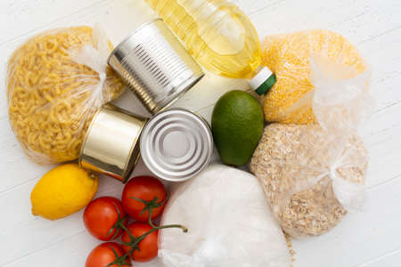 Food donations on wooden background, top view with copy spaceの写真素材
