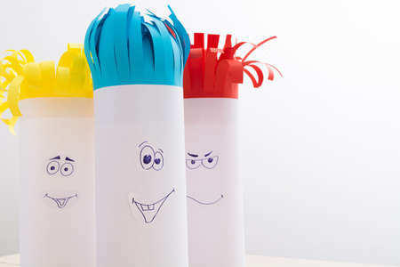 Creativity paper handmade for children. Funny faces on tubes with colorful hairの写真素材