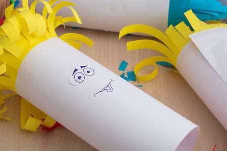 Creativity paper handmade for children. Funny faces on tubes with colorful hairの写真素材