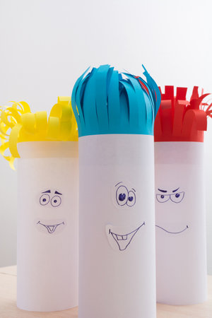 Creativity paper handmade for children. Funny faces on tubes with colorful hairの写真素材