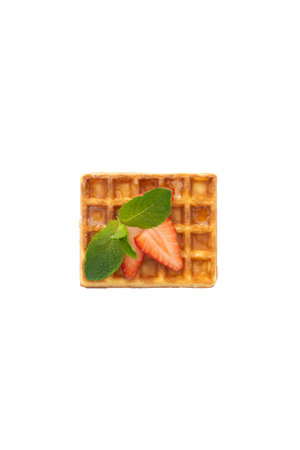 Belgium waffle with strawberry and mint on white isolated backgroundの写真素材