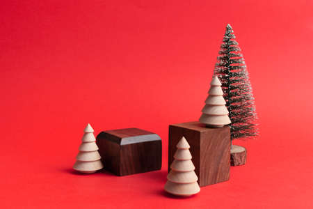 Two wooden empty geometric podiums on red background Minimal mockup in eco styleの写真素材
