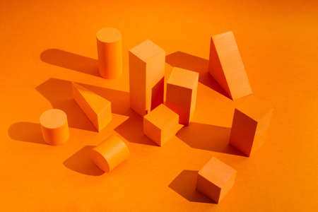 Orange platforms with empty space for products with geometrical figuresの写真素材
