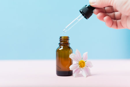 Natural organic liquid medicine or cosmetic oil for spa in brown glass bottleの写真素材