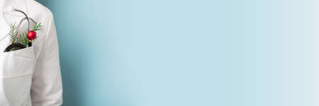 Christmas banner for medicine with doctor on blue background. Copy spaceの写真素材