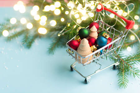 Christmas shopping concept with miniature trolley with decoration. Copy spaceの写真素材