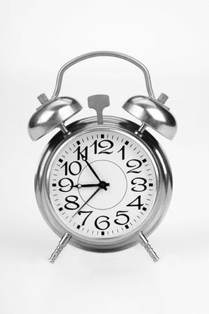 Alarm clock on a white backgroundの写真素材
