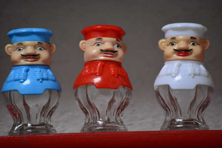 cooks in glass and colored plastics in colors red and whiteの写真素材