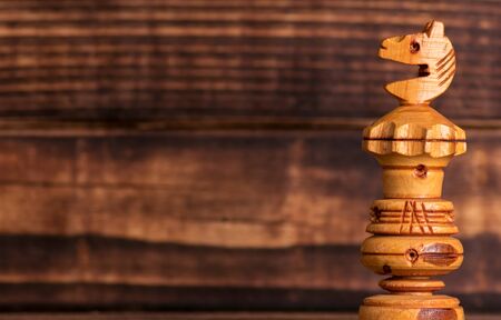 Wooden chess on wooden backgroundの写真素材