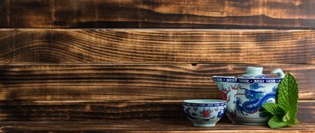 Chinese tea cup accompanied by peppermintの写真素材