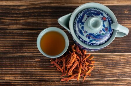 Chinese tea cup accompanied by red teaの写真素材