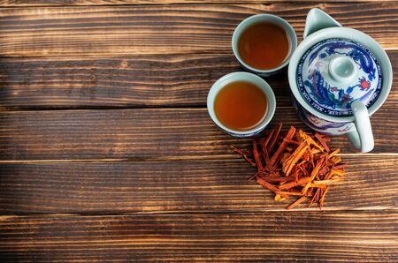 Chinese tea cup accompanied by red teaの写真素材