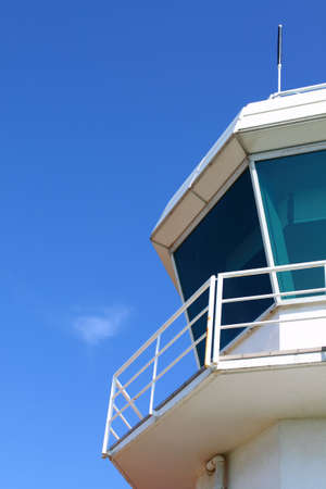 Part of aerodrome control tower against clear sky, with copyspaceの写真素材