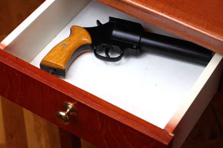 Flare gun forgotten in old desk drawerの写真素材