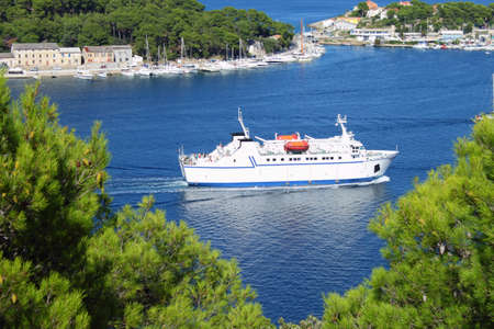 Ferryboat entering port of Mali Losinj, Croatia
