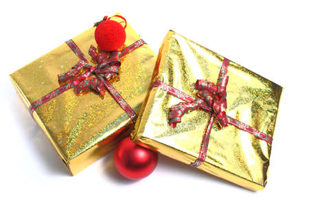 Two Christmas presents with red Christmas ornaments