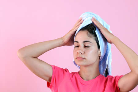 Beautiful young woman relaxing after a wellness treatment at the spaの写真素材