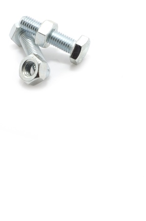 a pair of bolts and nuts on a white background with space for textの写真素材