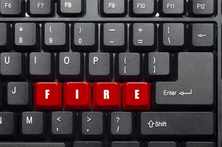fire word on red and black keyboard buttonの写真素材