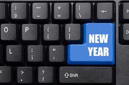 new year words on blue and black keyboard buttonの写真素材