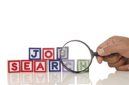 job search word blocks with magnifying glass isolated on white backgroundの写真素材