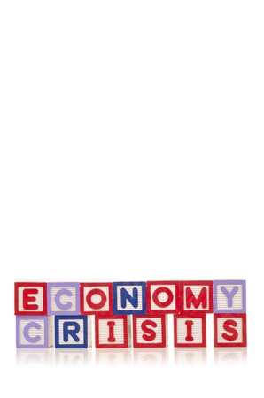 Economy crisis word at wood blocks isolated on white backgroundの写真素材