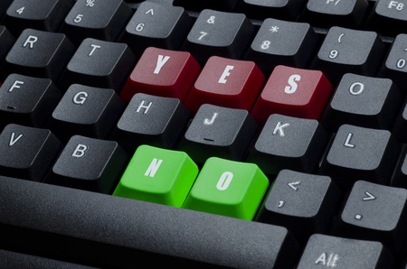 yes and no words on red and green keyboard buttonの写真素材