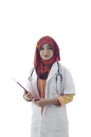 beautiful muslim medical doctor woman with red book isolated on white backgroundの写真素材