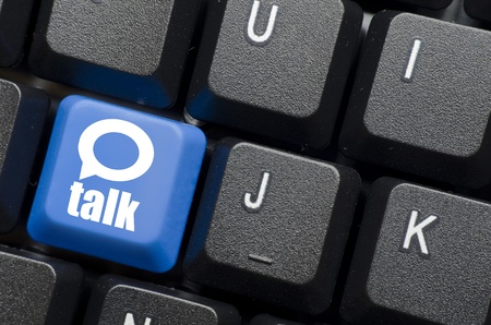 talk word with icon on blue keyboard buttonの写真素材
