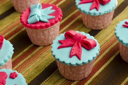 Close up colorfull cup cake on cotton backgroundの写真素材