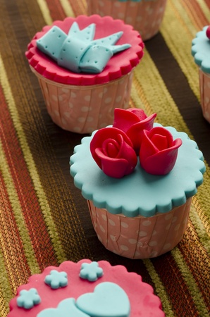 Close up colorfull cup cake on cotton backgroundの写真素材