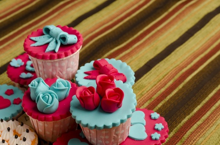 Close up colorfull cup cake on cotton backgroundの写真素材