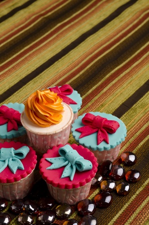 Colorfull cup cakes with marbles isolated beautiful cotton backgroundの写真素材