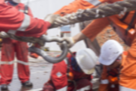 Marine crew doing anchor handling activities with motion blur effect.の写真素材