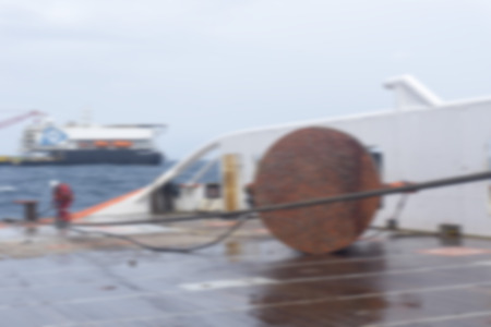 Marine crew doing anchor handling activities with motion blur effect.の写真素材