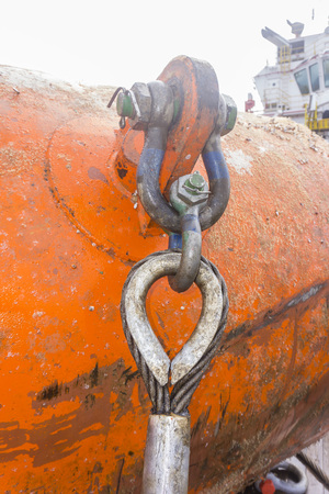 Industrial equipment. A heavy weight shackle with wire ropes attached to pad eye buoyancy tank for anchor handling activities.の写真素材