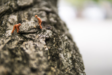 Miniature figures working in industrial - Close up of construction workers teamwork concept with selective focus.の写真素材