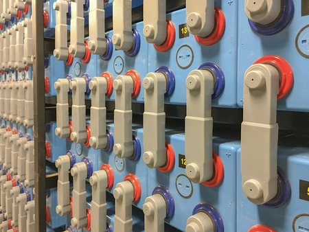 Compartment of heavy duty batteries in battery room.の写真素材
