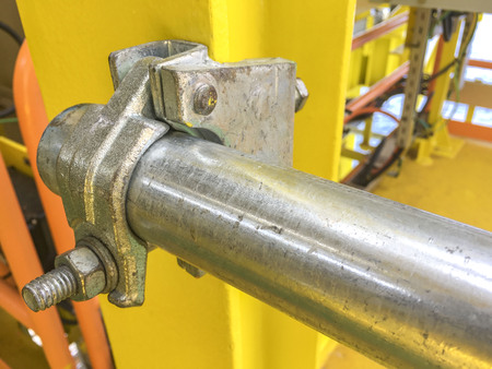 Scaffolding materials and equipment. Scaffold Girder Clamp at the edge of galvanized pipe.の写真素材