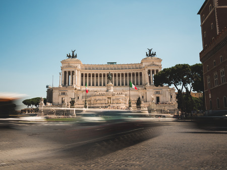 Altare della Patria and Piazza Venezia in Rome, Italy. A long exposure picture showing the intense traffic in the roundabout in front of the monument.のeditorial素材
