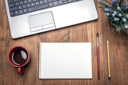 Cup Of Coffee, Sketchbook, Pencil And Brush Near Notebook On Wooden Tableの写真素材