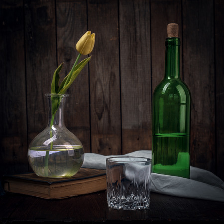 Vintage Still Life With Flowers On Book, And A Bottle Of Wineの写真素材