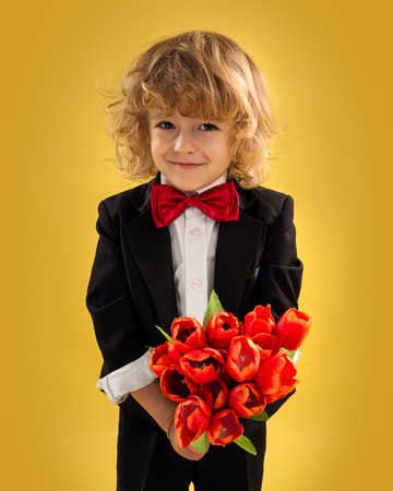 Little Boy Gentleman On Yellow Backgroundの写真素材