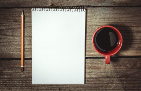 Cup Of Coffee, Sketchbook And Pencil On Wooden Table