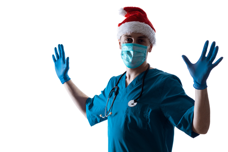 Man Doctor Surgeon In Christmas Santa Hat Isolated On White Background. Christmas Themeの写真素材